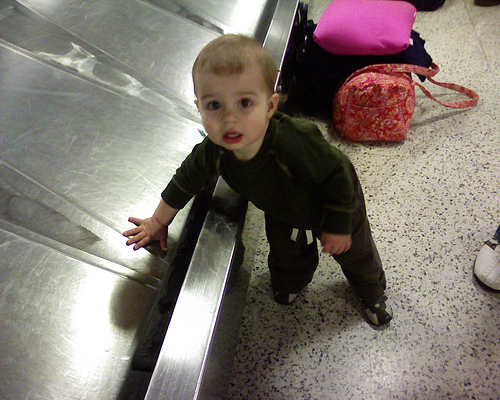 Child on baggage carousel